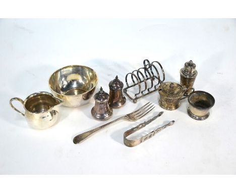 Various oddments of silver including cream and sugar pair, London 1930, a small toastrack, Victorian Christening fork, pair o