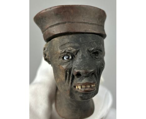 AN EARLY 19TH CENTURY WOODEN PIPE DEPICTING A MAN, with one glass eye and scars on side of face. Well used, but good conditio