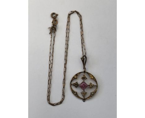 9CT GOLD AMETHYST AND SEED PEARL DISC PENDANT ON A FINE TRACE CHAIN (ONE SEED PEARL DISPLACED AND SOME PEARLS MISSING) 3.4G A