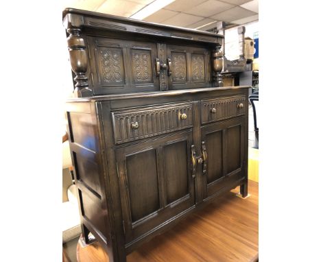 ERCOL DARK ELM CARVED COURT CUPBOARD 131CM H X 127CM W X 51CM D