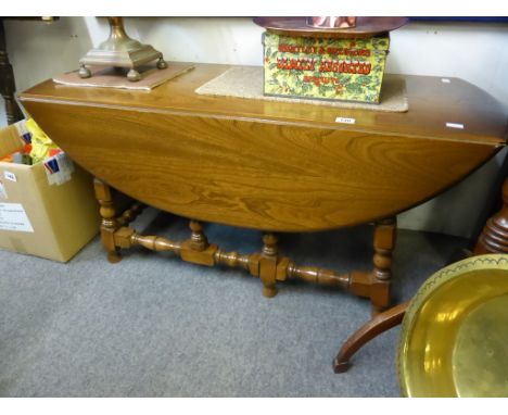 A vintage Ercol drop leaf gateleg table.