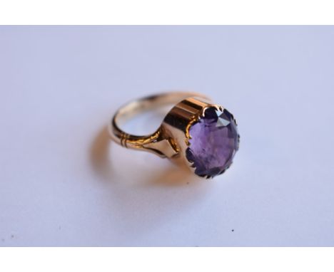 A 9ct gold and amethyst single stone ring