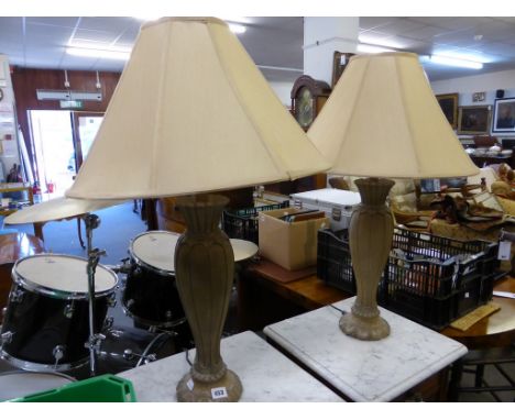 A pair of ceramic table lamps with silk shades