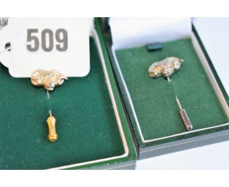 A 9ct gold rams head stick pin + 925 silver rams head stick pin.