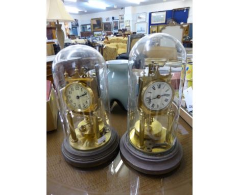 Two brass anniversary clocks with glass domes by Gustav Becker one with Arabic enamel dial, no. 2080289, the other Roman enam