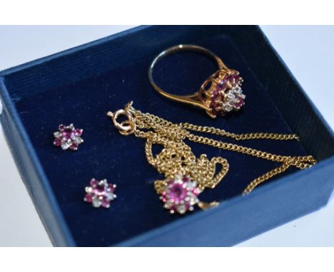 A suite of 10ct gold, ruby and diamond jewellery inc. a ring, pendant on chain and earrings (4)