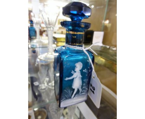 A turquoise blue glass scent bottle in the style of Mary Gregory, white enamel decoration of a young girl, alongside a pond s