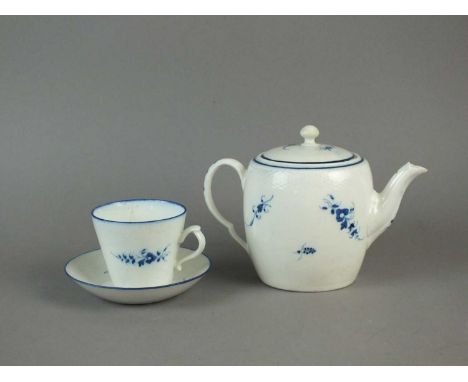 A Caughley 'Chantilly Sprigs' barrel-shaped teapot and cover circa 1779-88 with matching teacup and saucer, painted in underg