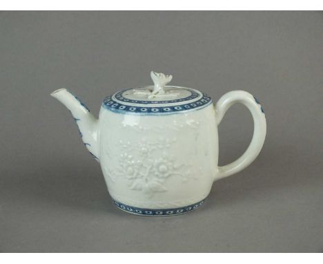 A Worcester barrel-shaped teapot with relief moulded floral decoration, underglaze blue printed cell diaper upper and lower b