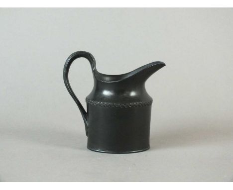 A rare Caughley black basalt cream jug circa 1780-90 of helmet form with pleated detail to body and acanthus-moulding to the 