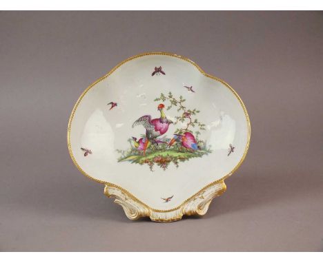 A Worcester shell-shaped dessert dish circa 1775-80 painted by George Davis with exotic birds amongst foliage, gilt dentil ri