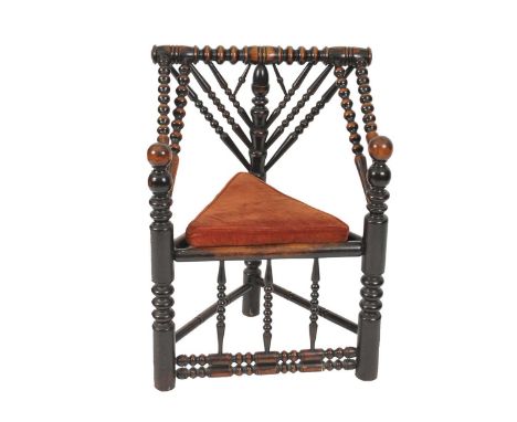 A 19th century turners chair, of good colour, the 'V' shaped back with a central acorn finial, the arm supports with spherica