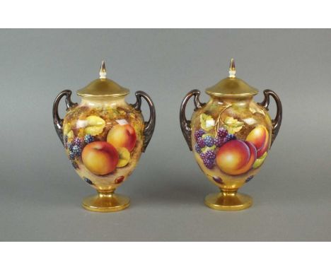 A pair of Royal Worcester twin-handled vases and covers mid-20th century painted with still lifes of grapes, apples and peach