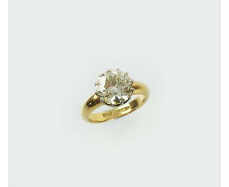 A single stone diamond ring, the brilliant cut diamond within twelve claw setting, mounted in white metal to yellow metal sha