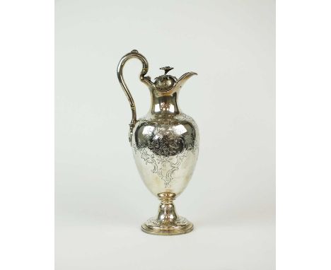 An early Victorian silver wine ewer, Barnard Brothers, London 1846, of pedestal baluster form with engraved scroll and foliat