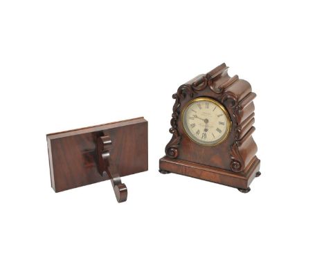 A Victorian mahogany bracket timepiece, the foliate scroll carved, shaped case, with a plinth on squashed bun feet, the 5" pa