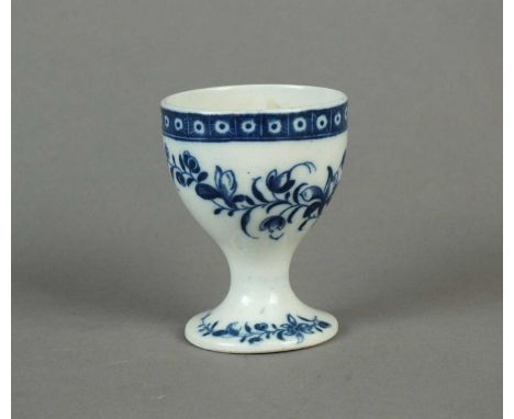 A very rare Caughley egg cup circa 1785 transfer-printed with floral sprays below a cell diaper border to the rim, further sp
