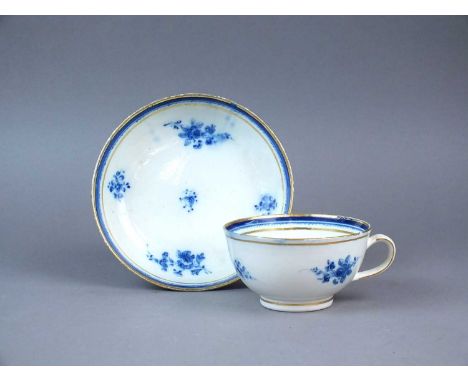 A Caughley breakfast cup and saucer circa 1785-95 painted in light blue with the 'Salopian Sprigs' pattern with small cluster