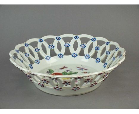 A Worcester polychrome basket circa 1775 painted to the interior well with a spray of flowers, fruit and scattered insects, t
