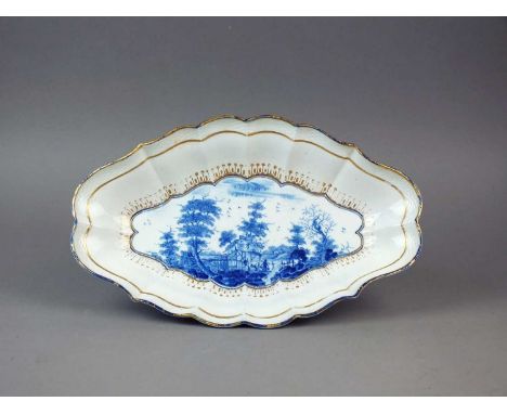 A very rare Caughley dessert centre dish circa 1788-93 of melon shape with a basket-weave border, finely painted in light blu