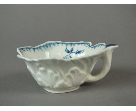 A rare Caughley butter boat circa 1776-80 of geranium leaf form, painted in blue with the 'Gooseberry' pattern, painted C mar