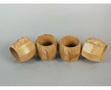 Workshop of Robert Mouseman Thompson (Kilburn) a set of four napkin rings, of octagonal form, each carved with a characterist