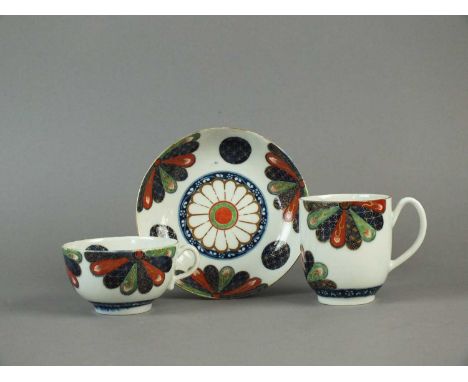 A Worcester trio of a teacup, coffee cup and saucer in the 'Japan Fan' pattern circa 1768-75 brightly decorated in the Imari 