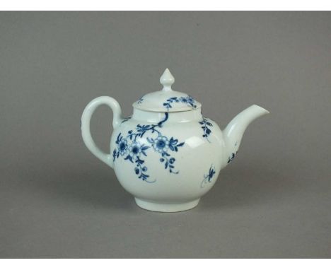 A Worcester 'Prunus Root' teapot and cover circa 1760 painted in blue with the flowering branches, domed cover, knop finial, 