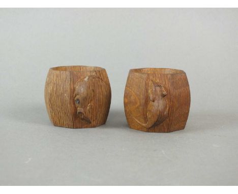 Workshop of Robert Mouseman Thompson (Kilburn) a pair of carved oak napkin rings of octagonal form, each carved with a charac