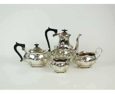 An Edwardian four piece silver tea and coffee service, Birmingham 1903 &amp; 1907,each piece of shaped oval form with engrave