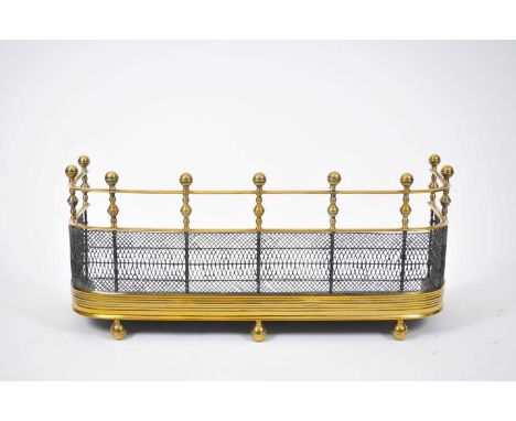 A 19th century brass fireguard, with a balustered upper section and mesh below, 79 x 27 x 37cm high