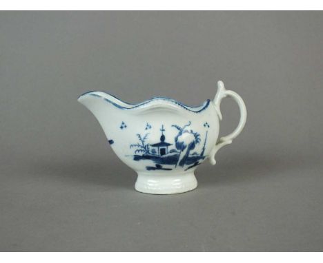 A Caughley cream boat circa 1777-85 of 'gadroon' shape, painted in underglaze blue with the 'Rock House Island' pattern below