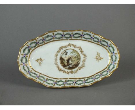 A Caughley spoon tray circa 1792-97 of canted oval form, painted with circular 'European Landscape' panel between a gilt wrea