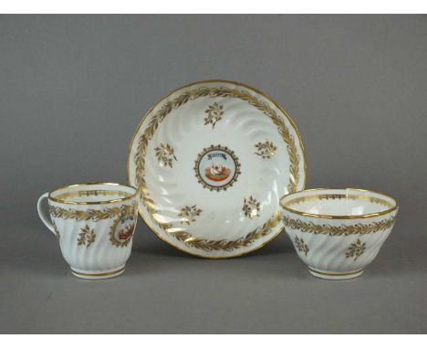 A Caughley trio of tea bowl, coffee cup and saucer of spiral fluted form, painted with the 'L'Amitie' pattern with central mo