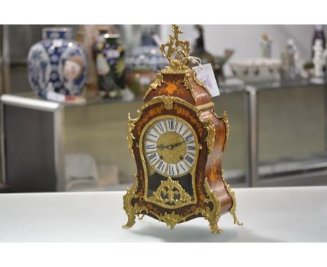 A Louis XV style gilt-metal mounted marquetry bracket clock, 20th century of cartouche shape, the 17cm embossed gilt dial wit