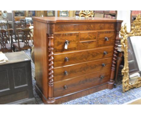 A 19th century mahogany Scotch chest, the rectangular top with outset corners, above an arrangement of drawers, with turned p