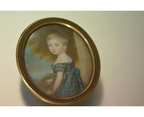 English School, early 19th century, a portrait miniature of a young child in a tartan dress, watercolour on ivory, in a gilt-