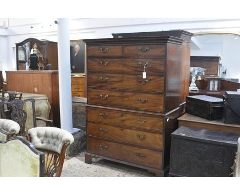 A George III mahogany chest on chest, c. 1800, the upper section with moulded cornice and dentilled frieze above two short an