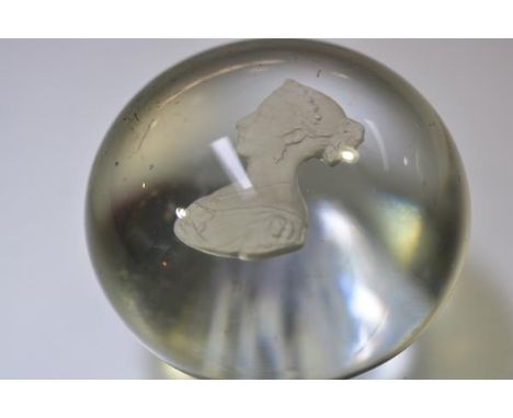 A 19th century clear glass sulphide paperweight, with a portrait bust of the young Queen Victoria. Diameter 6.5cm