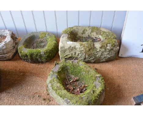 A group of three weathered stone small garden trough planters, one indistinctly carved with a date "18..".  (3) Largest 20cm 