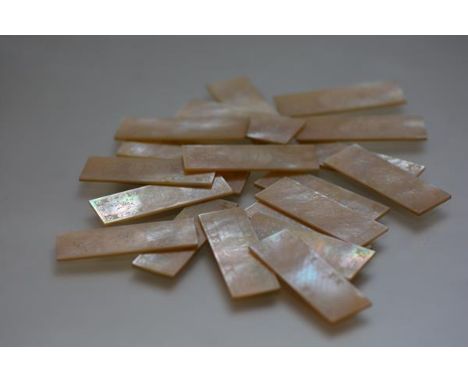 A set of twenty Chinese export mother-of-pearl gaming tokens, 19th century, each of rectangular form centred by a monogrammed