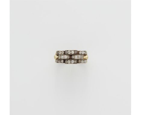 Retro Stil-Ring mit Diamanten14 kt Gelbgold. Gebuckelter Ringkopf aus versetzt angeordeten Rundscheiben, bogenförmig ausgefas