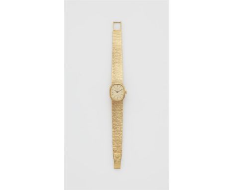 Patek Philippe Ellipse Ladies18 kt Gelbgold. Damenarmbanduhr mit ovalem Gehäuse aus Gold und Saphirglas. Goldenes satiniertes