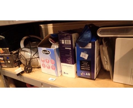 Shelf of domestic electrical items including radios CD player telephone etc with three mobile phones behind the counter  COND