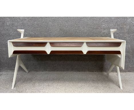 A mid-century Italian white painted desk/sideboard with three frieze drawers raised on splayed tapering supports, in the mann