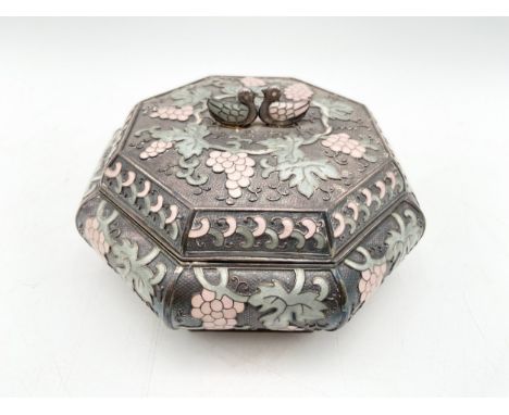 A Korean .99 silver and enamel octagonal champlevé and cloisonné box with a figural duck finial and scrolling grape and vine 