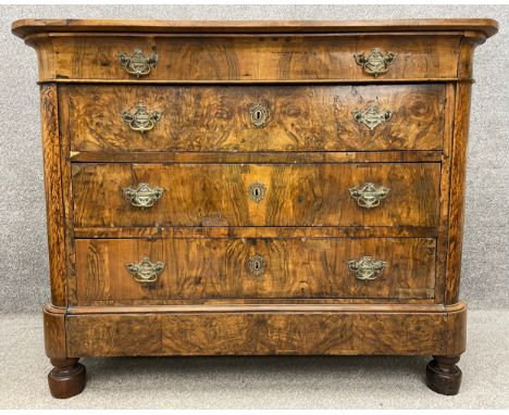 A late 18th/early 19th century French Louis Philippe commode with a solid walnut top above one long shaped concealed frieze d