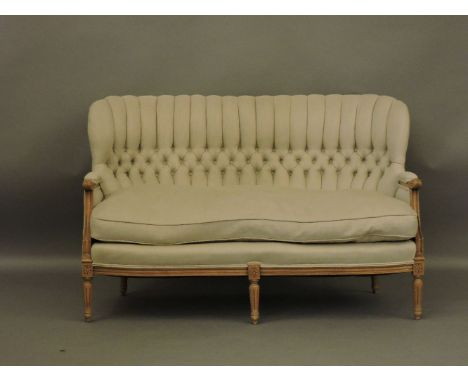 A George III walnut framed sofa, button back with loose cushion seat, reupholstered in linen, on tapering feet, Provenance: f