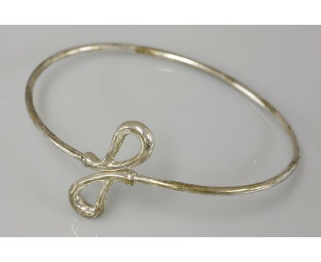 A Tiffany & Co sterling silver crossover bangle, by Elsa Peretti
