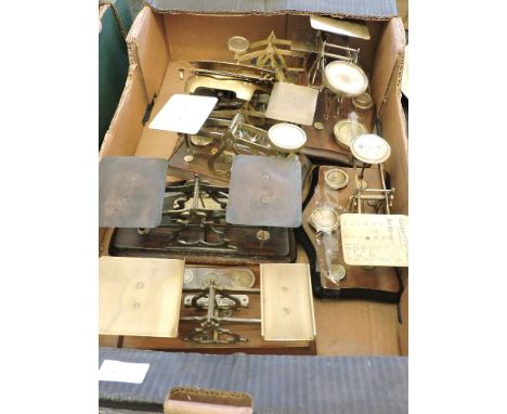 A quantity of early 20th century and later brass postal scales, to include an example by Vandomes, some with original weight 